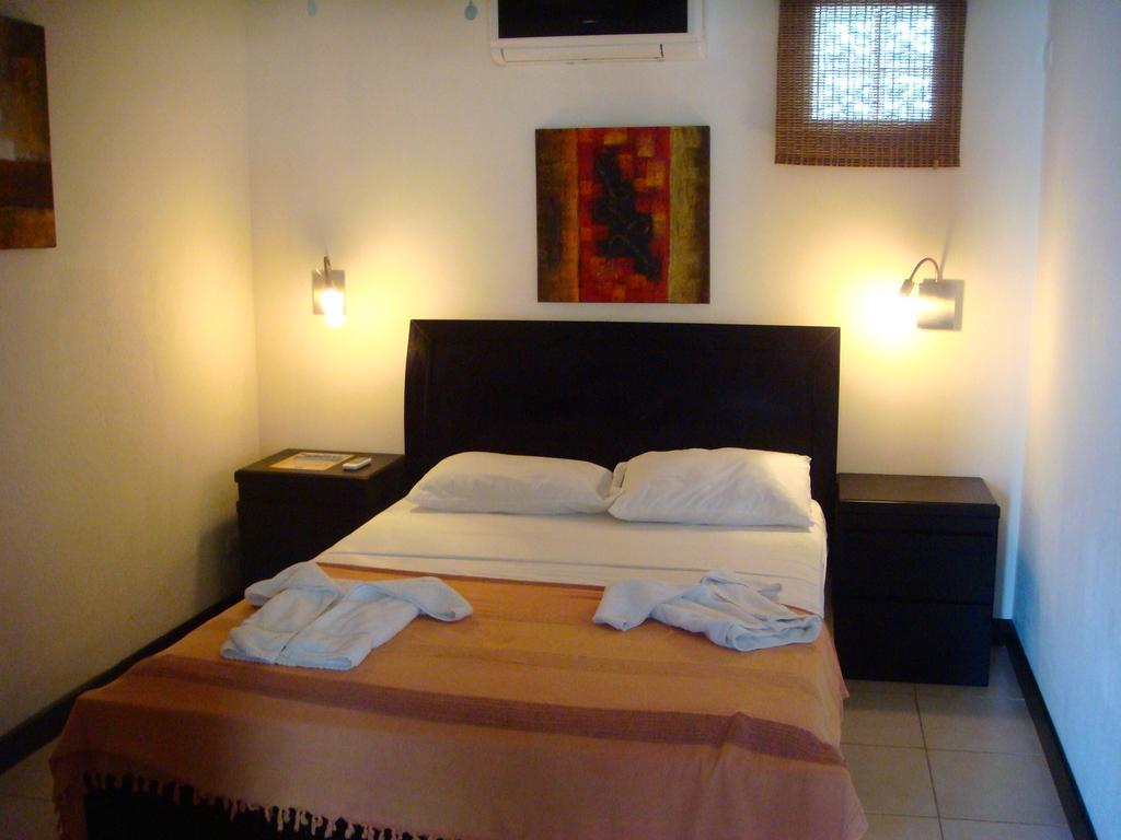 Tuanis Aparthotel Jacó Zimmer foto